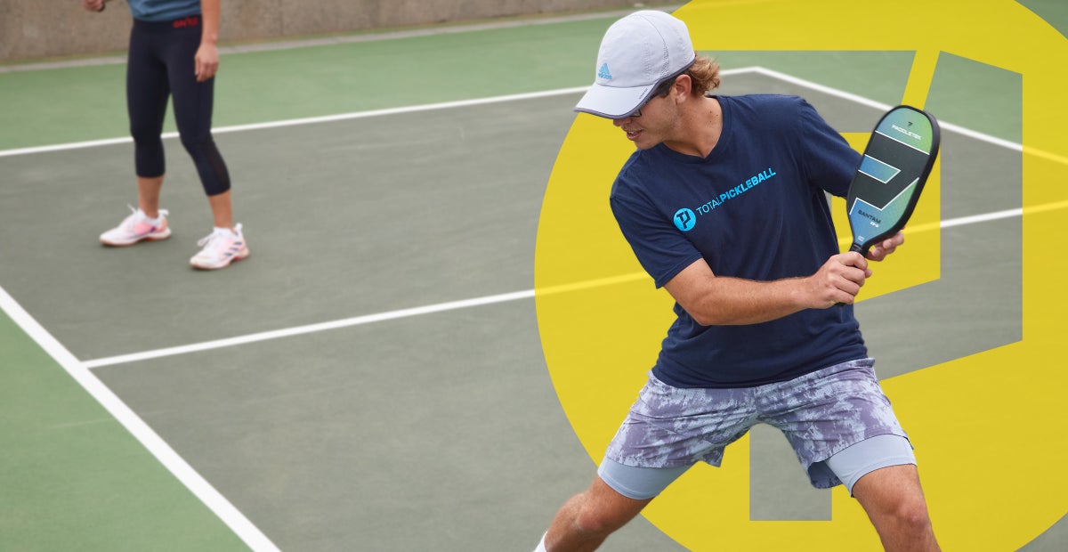 A young man playing a back hand in pickleball from the ste of Tennis Warehouse who sell pickleball shoes.