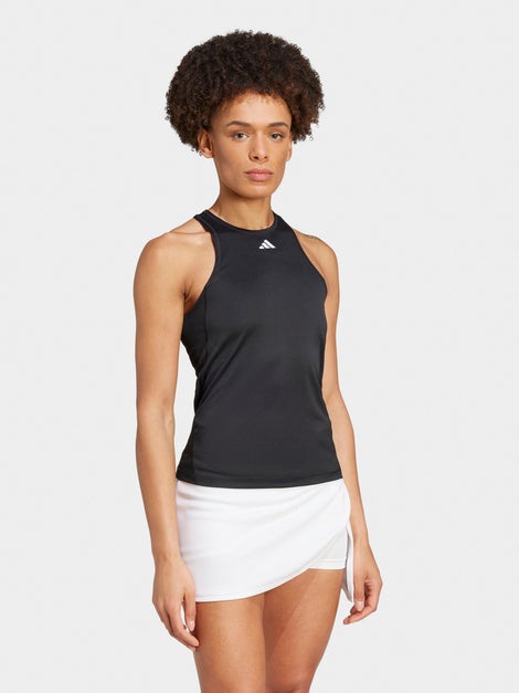 Woman wearing a black adidas tank top.