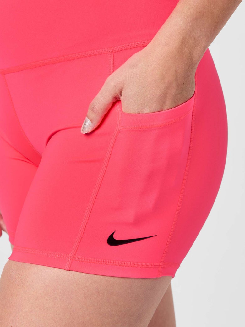 Pink Nike Ball Tight with hand in the pocket