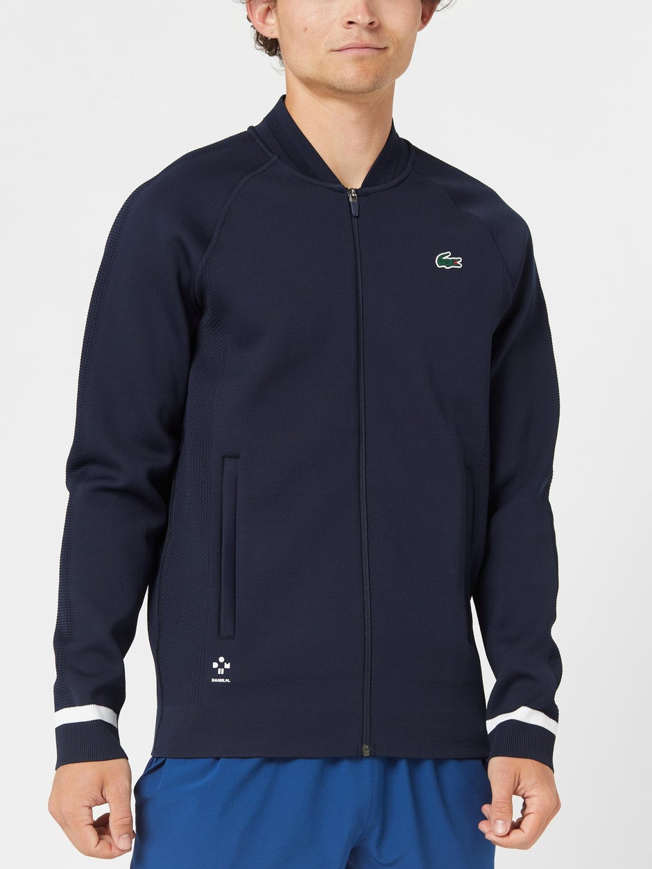 Man in a tennis jacket. 