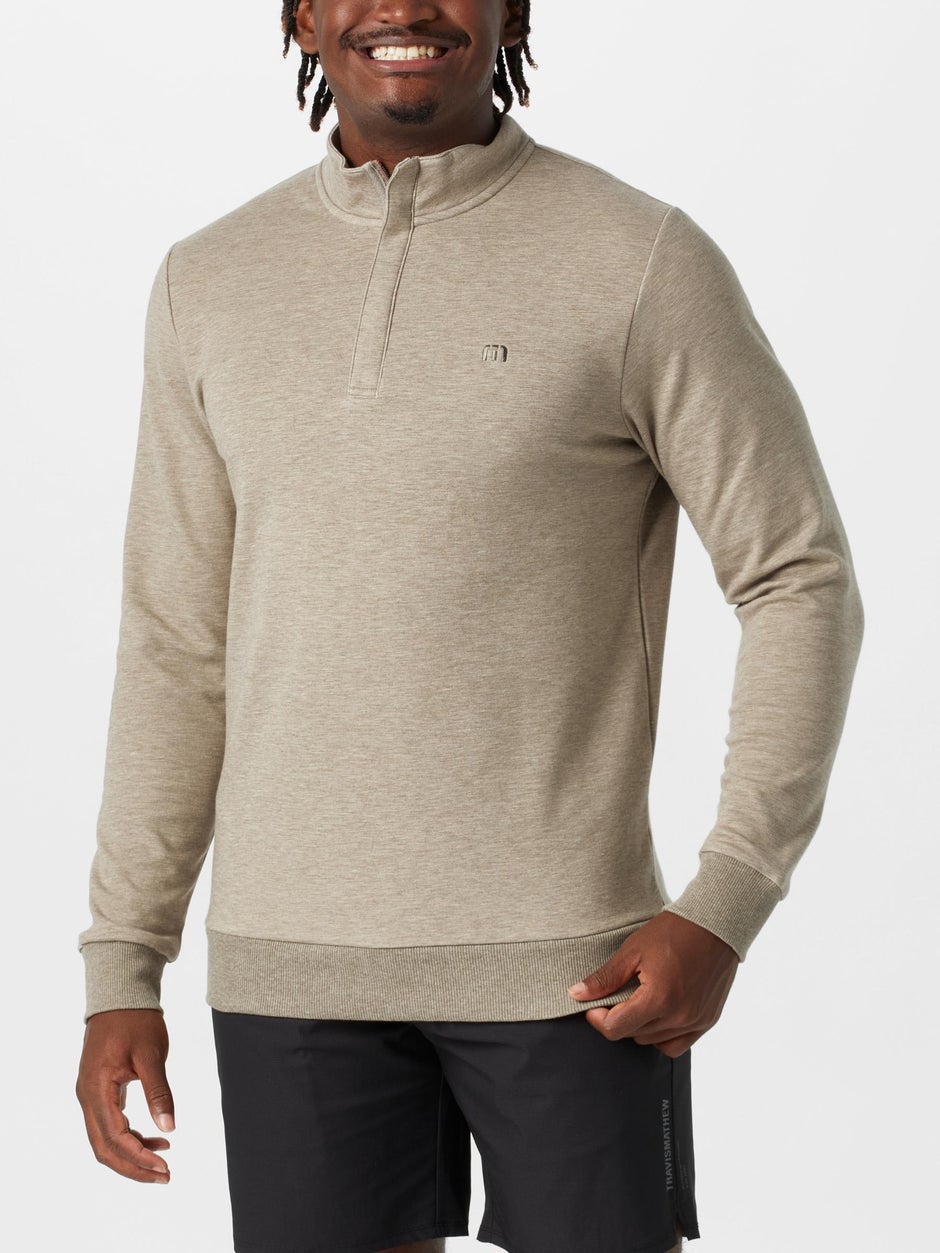 Man tennis player in a cozy sweater. 