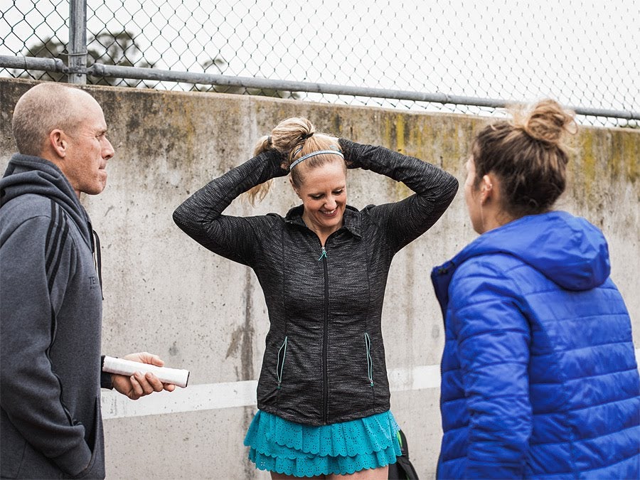 Image of tennis players in colder months. 