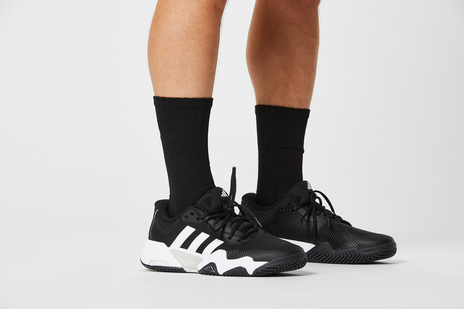Black socks with black shoes. 