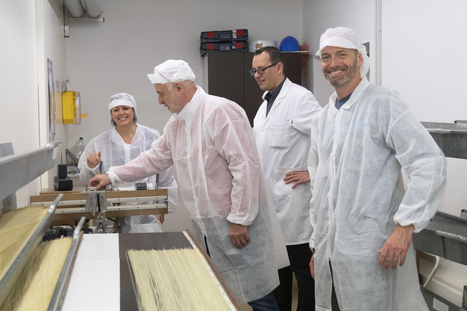 TW staff in Babolat's string factory. 