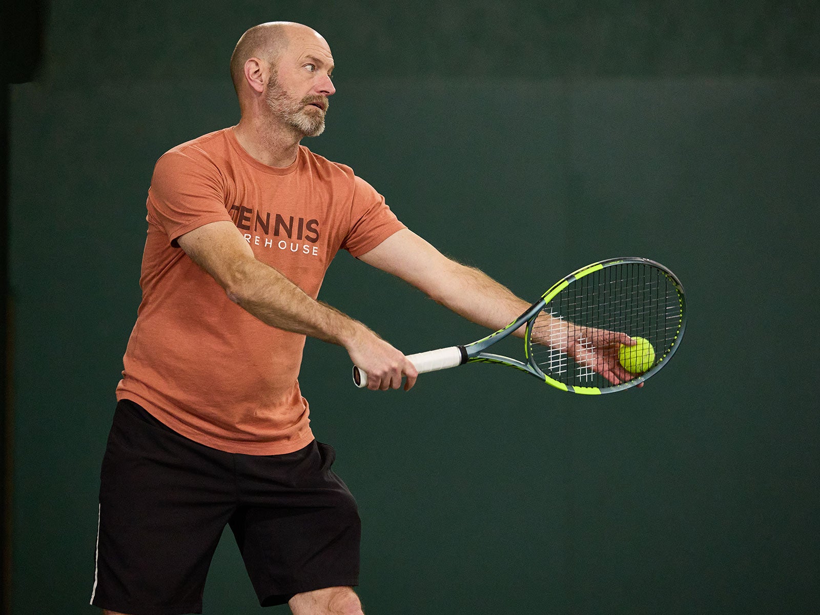 TW playtester hitting a serve.