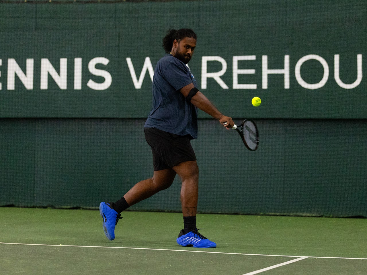 TW playtester hitting a backhand.
