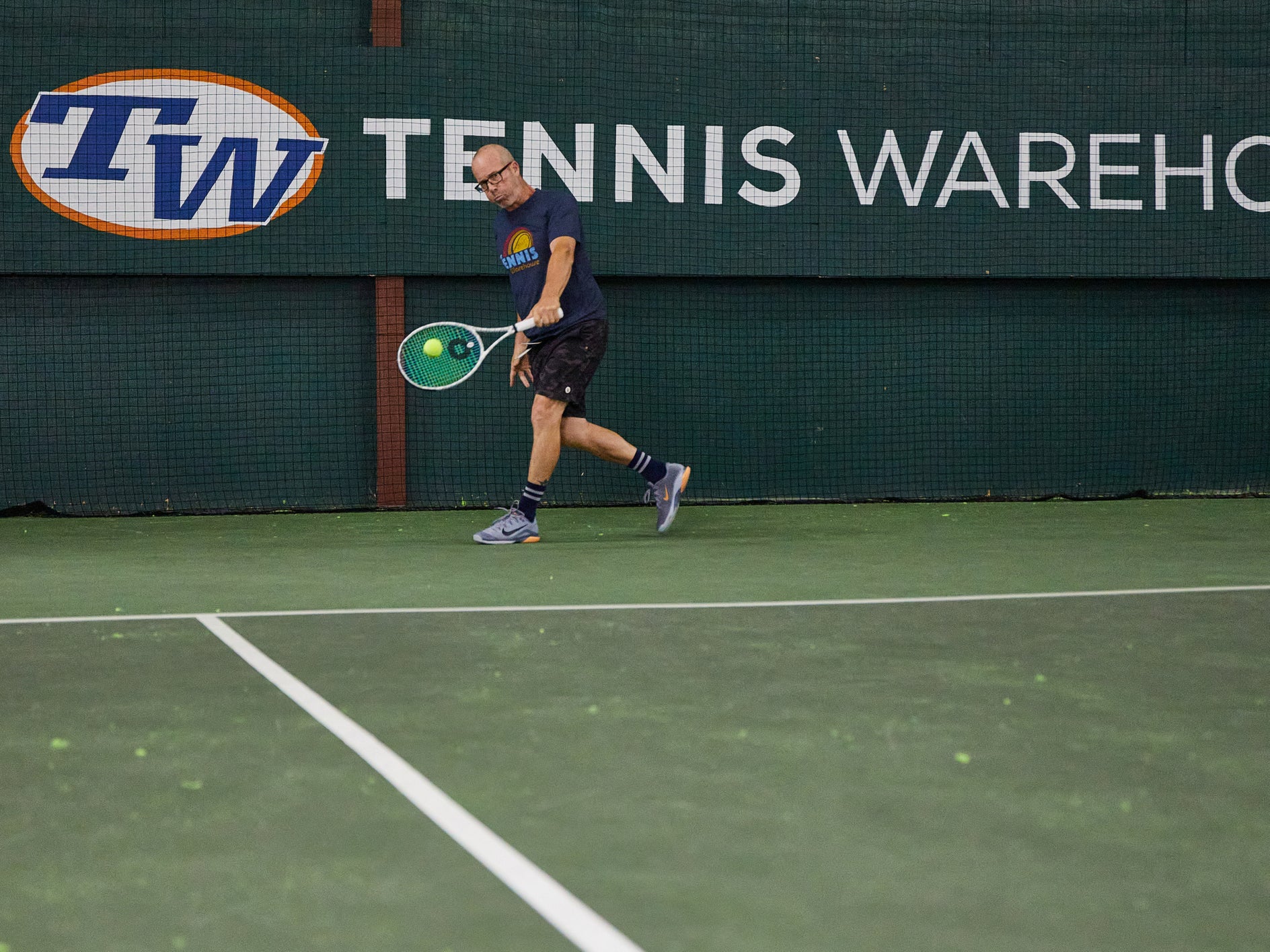 TW playtester hitting a backhand with the Solinco Whiteout 305 18x20 XTD v2.