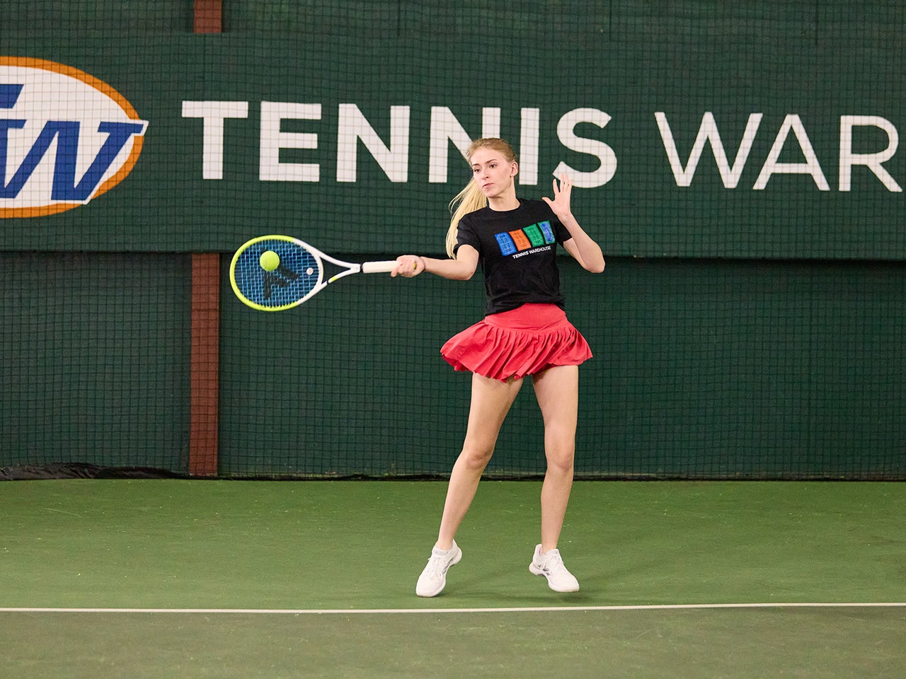 TW playtester hitting a forehand with the Fire 305s.
