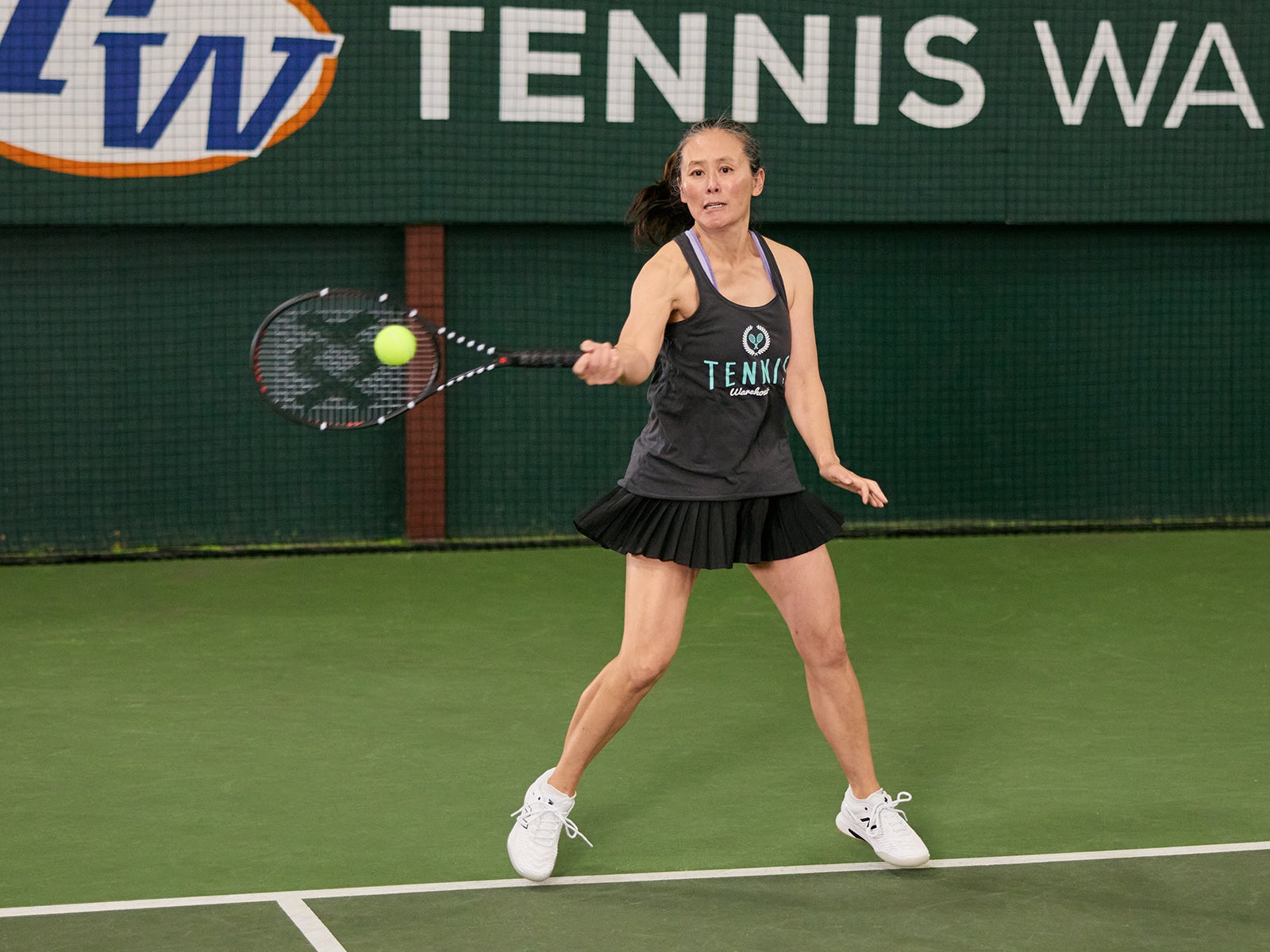 TW playtester hitting a forehand with the Vostra V7. 