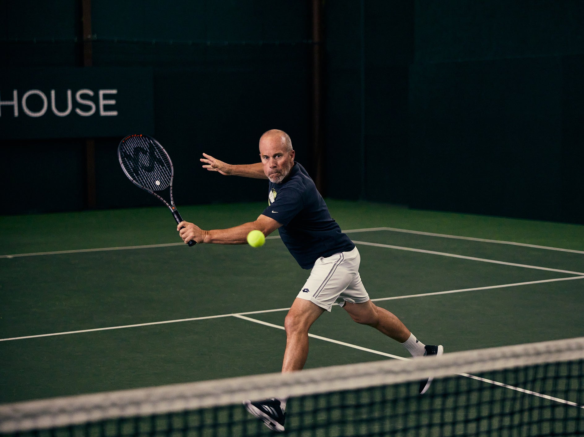 TW playtester hitting a backhand volley with the Vostra V9 290g. 