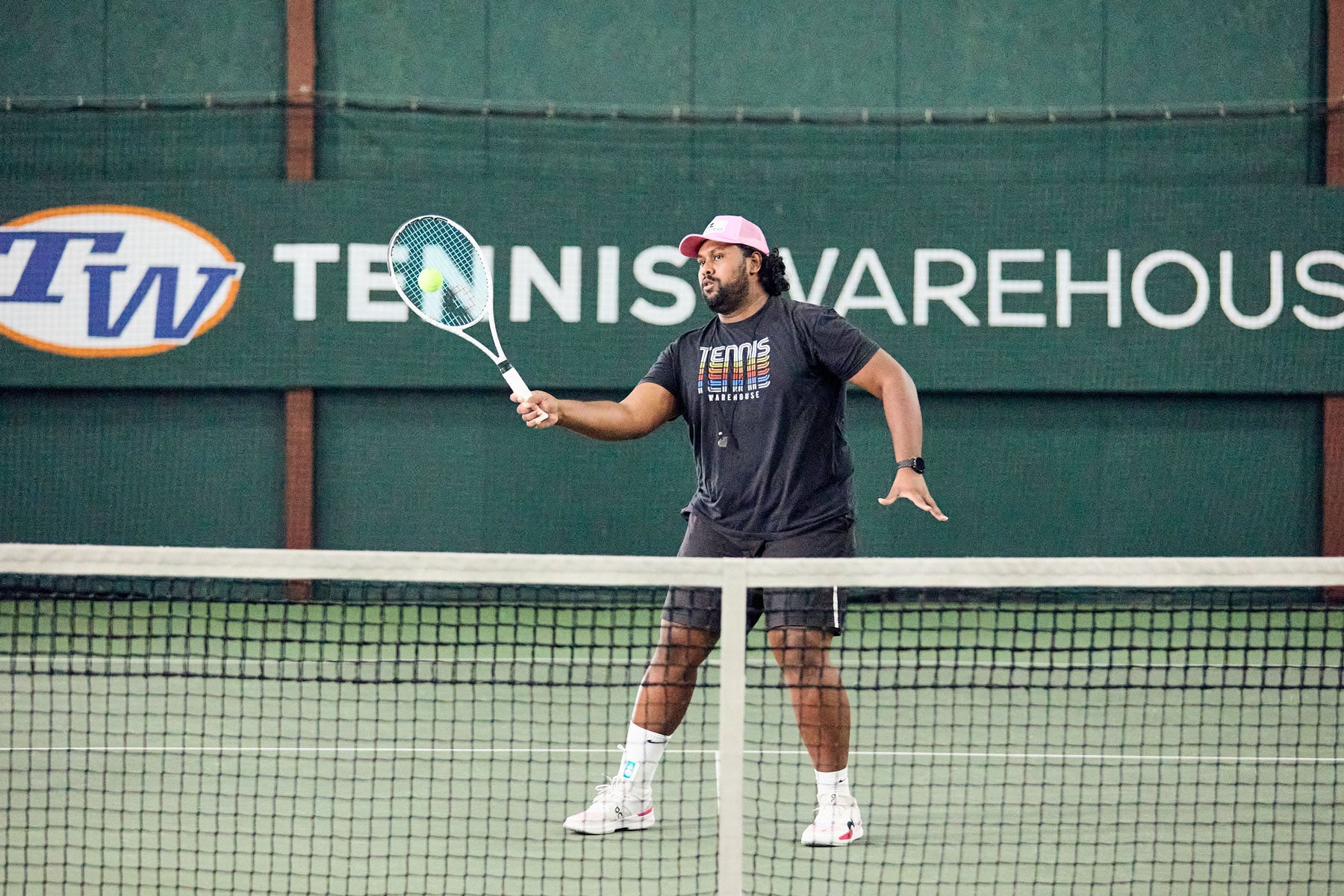 TW playtester hitting a volley with the Solinco Whiteout 305 16x19