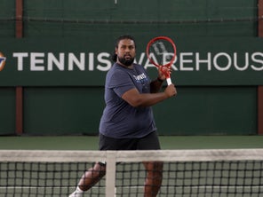 Image of a TW playtester hitting a volley. 
