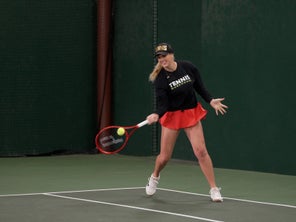 Image of a TW playtester hitting a forehand. 