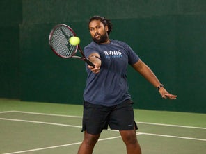 Image of a Playtester Hitting a Volley