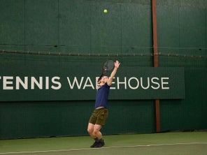 Image of a Playtester Hitting a Serve