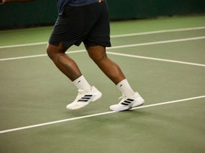 Image of the adidas Barricade 14s flexing in motion. 