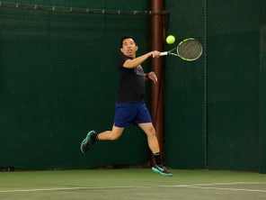 TW playtester hitting a forehand in the air. 
