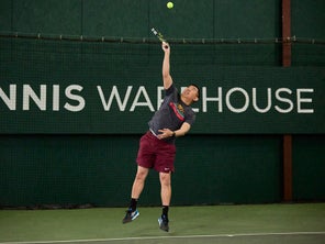 Playtester hitting a serve