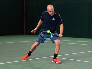 Image of a Playtester Hitting a Backhand Volley
