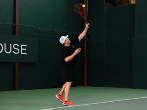 Image of a Playtester Hitting a Serve