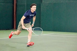 Image of a Playtester Moving Forward to Hit a Tennis Ball