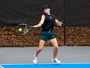 Image of a TW playtester hitting through a forehand. 