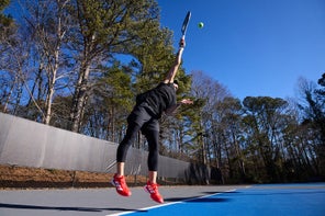 Image of a Playtester Hitting a Serve