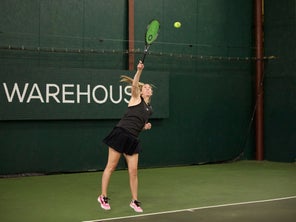 Image of a Playtester Hitting a Serve
