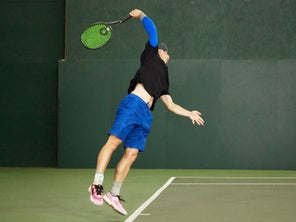 Image of a Playtester Hitting a Serve