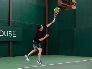 Image of Playtester Hitting a Serve