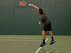 Image of a TW playtester hitting a serve. 