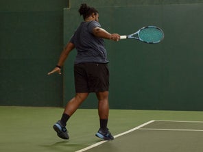 Image of a TW playtester stepping into a backhand. 