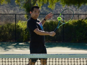 Image of a TW playtester hitting a volley. 