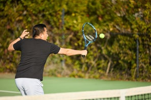 Image of a TW playtester hitting a volley. 