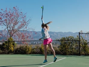 Image of Playtester Hitting a Serve