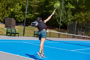 Image of a Playtester Hitting a Serve