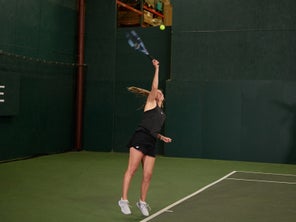 Image of a Playtester Hitting a Serve