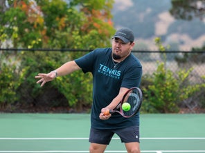 Image of a Playtester Hitting a Volley