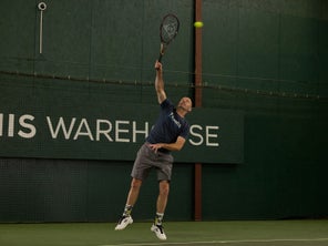 Image of a TW playtester hitting a serve. 