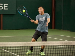 Image of a TW playtester hitting a volley. 