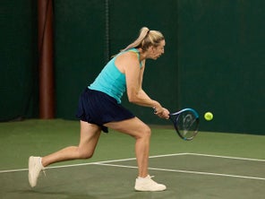 Image of a TW playtester hitting a backhand. 