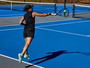 Image of a TW playtester hitting a return. 