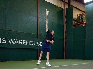 Image of Playtester hitting a serve