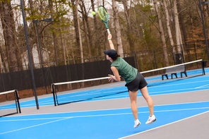 Image of a Playtester Hitting a Serve