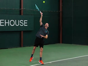 Image of a Playtester Hitting a Serve