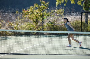 Image of a TW Playtester hitting a volley. 