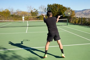 Image of a TW Playtester hitting a return. 