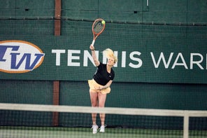 Image of a Playtester Hitting a Serve