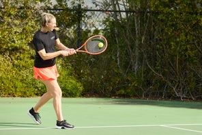 Image of a TW playtester hitting a return. 