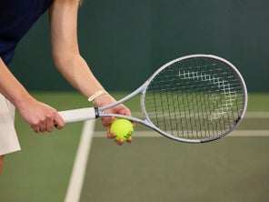 TW playtester hitting a serve. 